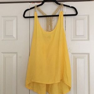 Yellow tank with gold colored chain straps